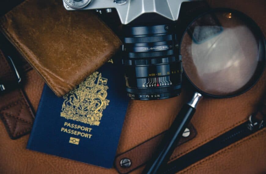 Camera, magnifying lens and passport